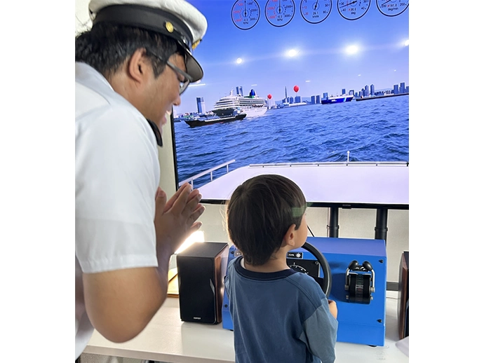 Serious at the helm — A future mariner in the making!