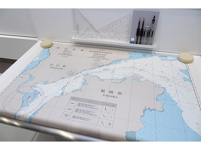 The nautical chart used for the vessel simulator route near the Kanmon Straits was created based on charts actually used by navigators. The handwritten notes were added by NYK navigators. 