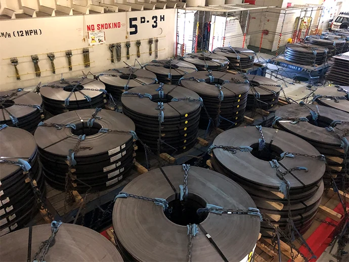 Cargo includes construction vehicles, railway cars, and even wind turbine blades. Non-self-propelled cargo is transported using roll trailers.