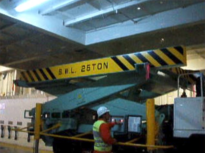Special lifting vehicle, called a “liftable car,” used to raise the ceiling height