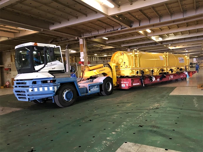 Cargo includes construction vehicles, railway cars, and even wind turbine blades. Non-self-propelled cargo is transported using roll trailers.